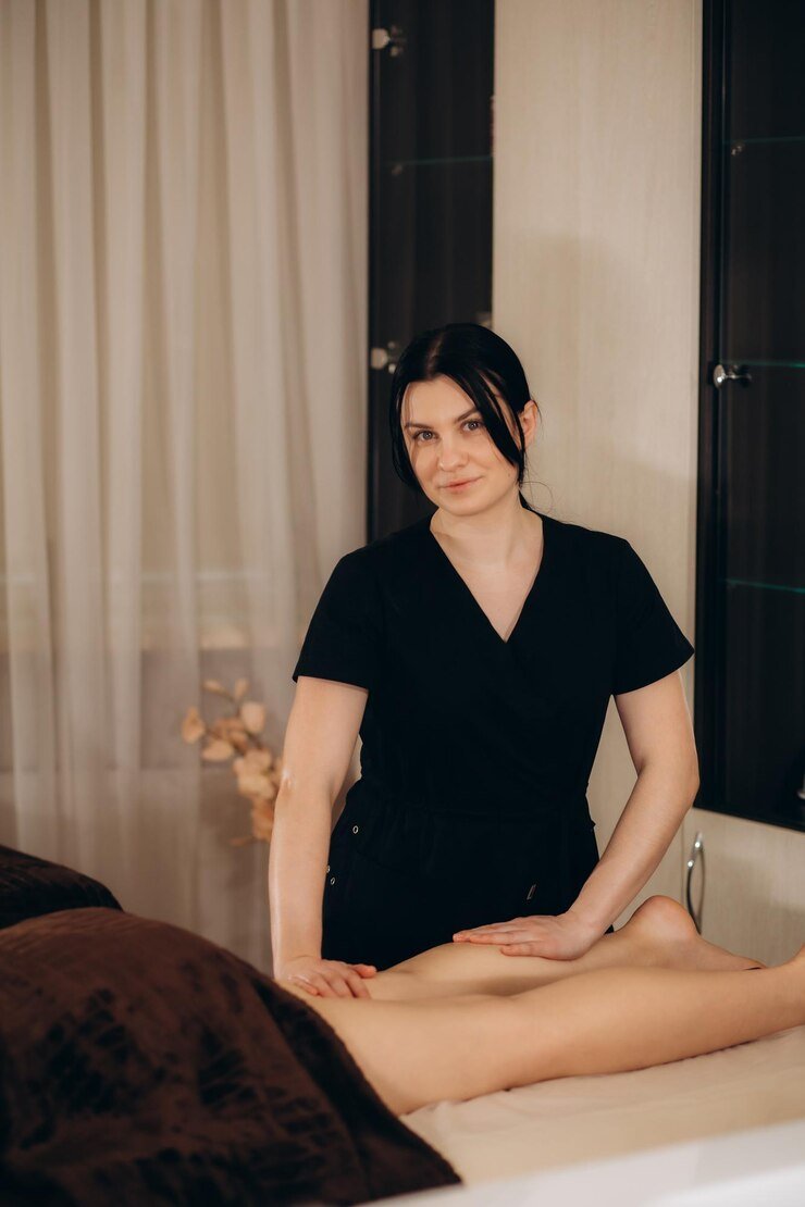 professional-caucasian-specialist-is-doing-leg-message-modern-minimalistic-salon_633611-11405.jpg